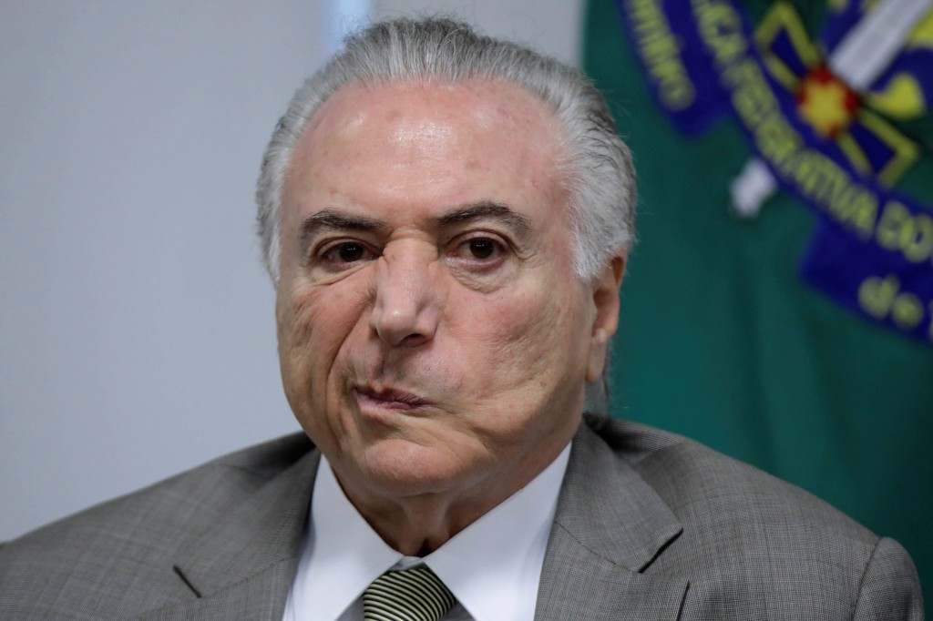Brazil's President Michel Temer, reacts during a meeting for announcement of resources for expansion and modernisation of Brasilia subway, in Brasilia